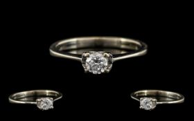 White Gold Single Stone Diamond Ring set with a round modern cut, estimated diamond weight .
