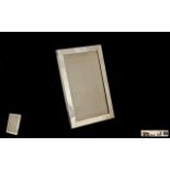 A Silver Photo Frame of Rectangular Shape From the 1920's. Wooden Back, Maker W.J.M & Co.