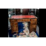 A Modern 20thC Pedestal Desk red tooled leather top with three frieze drawers above two banks of