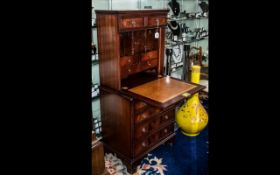 A 20th Century Ladies Writing Desk full front with fitted interior above three graduating drawers