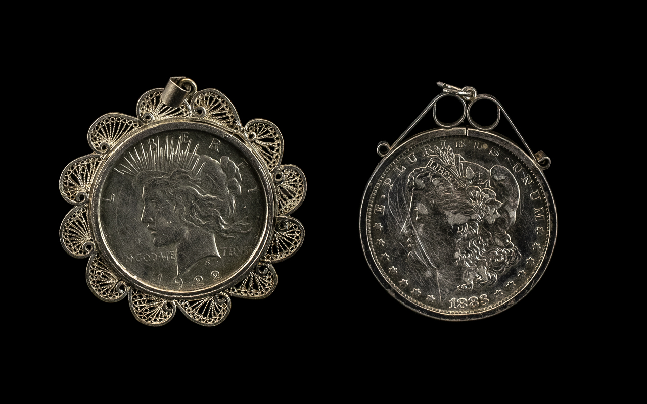 Two American Silver Dollars in Pendant Mounts dated 1883 and 1922.