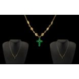18ct Good Emerald Cross Pendant Suspended on a 18ct Gold Chain,