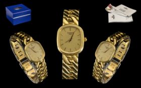 A Ladies 18ct Gold Tissot Wristwatch gilt dial with baton numerals, quartz movement. Length 7.