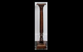 Early 20th Century Mahogany Torchere of turned support and carved and stepped terminal,