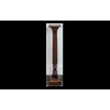 Early 20th Century Mahogany Torchere of turned support and carved and stepped terminal,