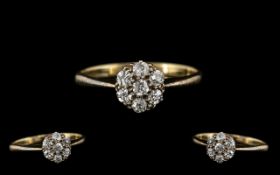 18ct Gold Attractive 7 Stone Diamond Set Cluster Ring In a Flower head Setting.