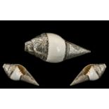 An Antique Tibetan Conche Shell Horn, Mounted In Silver, Finely Embossed with Floral Decorations and
