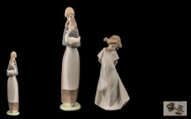 Nao by Lladro Pair of Hand Painted Porcelain Figures. Comprises 1/ Young Woman Holding a Duck.