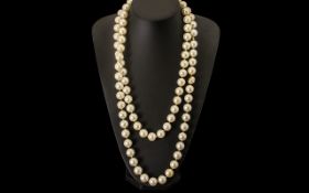 Long 1930's Faux Pearl Necklace. Length 60 Inches.