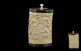African Carved Ivory Lidded Vase Depicting Village Crafts and Women Cooking, Ebony Wood Base and