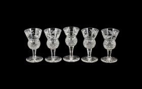 Five Edinburgh Crystal Thistle Liqueur Glasses signed to base, in excellent condition.