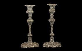 Pair of Silver Plate Rococo Style Candlesticks. Measuring 9.5 Inches In Height. Please See Image.