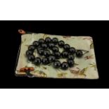 A Black Nephrite Jade Beaded Necklace Beautiful set of black jade nephrite beads from Western China,