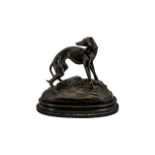 Early 20th Century Reproduction Bronze Figure Of A Greyhound Raised on an ebonised oval base,