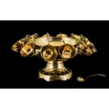 Large Brass Footed Punch Bowl with matching ladle and twelve cups;
