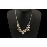 A Modern Fancy Silver Bauble Necklace. L