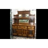 Edwardian Oak Mirror Backed Sideboard with a low mirrored back with side shelves,