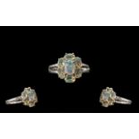 Opal Seven Stone Cluster Ring, an oval cut opal with an excellent display of colours,