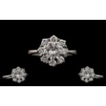 Stunning 18ct White Gold Attractive Diamond Set Cluster Ring, The Single Central Round Brilliant Cut