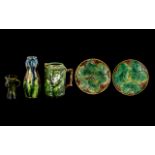 A Collection Antique Majolica to include a green leaf jug, two leaf plates and a Tyg Vase &