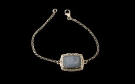 Angelite Centrepiece Bracelet, a 10ct cushion cut, rectangular cabochon of angelite,