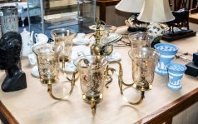 Six Branch Brass Chandelier with Shaped Arms, with six storm lantern shades.