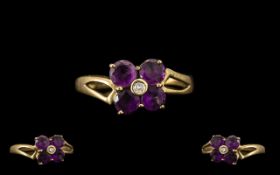 9ct Gold Ladies Amethyst Dress Ring. Flowerhead design, Ring size M.