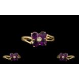 9ct Gold Ladies Amethyst Dress Ring. Flowerhead design, Ring size M.