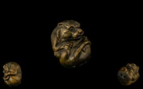 Oriental Boxwood Netsuke in the form of a tiger. Please see accompanying image.