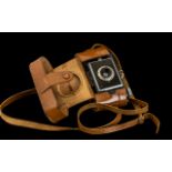 Vintage Kodak Bantam Camera in tan leather carry case. Please see image.