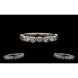 A Modern Contemporary Designed 18ct White Gold Diamond Set Half-Eternity Ring. Marked 750 - 18 ct.