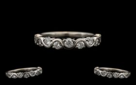 A Modern Contemporary Designed 18ct White Gold Diamond Set Half-Eternity Ring. Marked 750 - 18 ct.