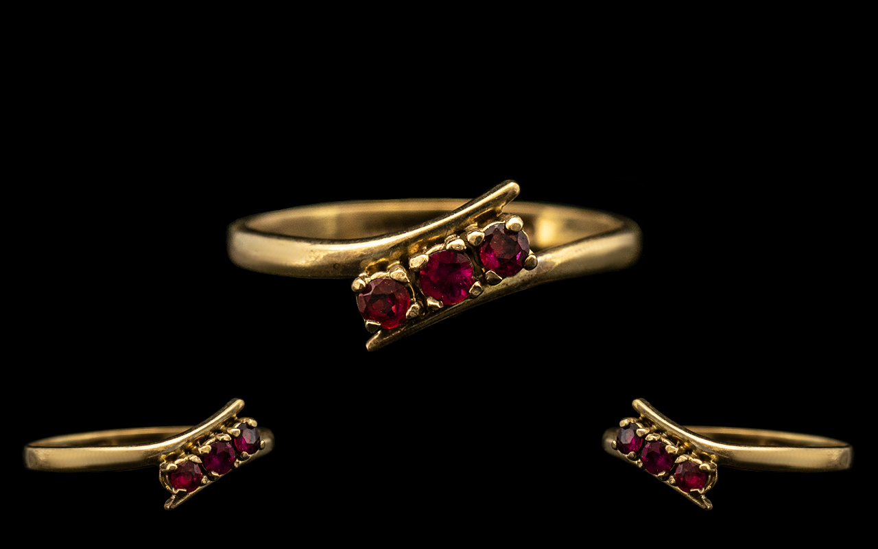 9ct Gold Vintage Ladies Ruby Dress Ring. Ring set with three small rubies, ring size M.