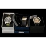 Three Contemporary Quality Watches in original boxes with instructions,