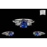 18ct White Gold Stunning 3 Stone Sapphire and Diamond Set Dress Ring the central natural corundum