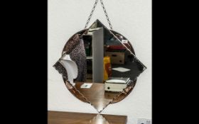 A 1950's Wall Mirror Diamond Shaped With Peach Engraved Trim, Chain Mounts,