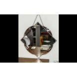 A 1950's Wall Mirror Diamond Shaped With Peach Engraved Trim, Chain Mounts,