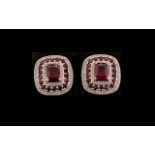 Ruby Pair of Large Stud Earrings, each earring having an octagon cushion cut solitaire ruby framed