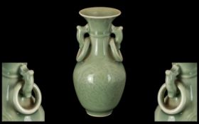 Small Chinese Celadon Glazed Vase of typical form,