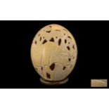 Large Antique Carved Ostrich Egg. Large Ostrich Egg with water buffalo carving, signed to bottom.