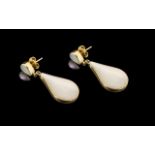 Large 9ct Gold Drop Earrings set with mother-of-pearl and black polished onyx;