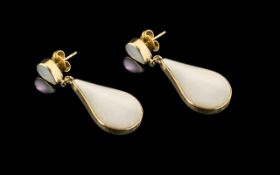 Large 9ct Gold Drop Earrings set with mother-of-pearl and black polished onyx;