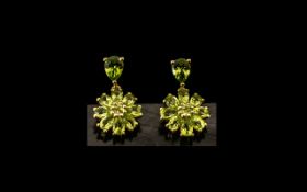 Peridot Pair of Cluster Drop Earrings, each comprising a circle of bright, sparkling,