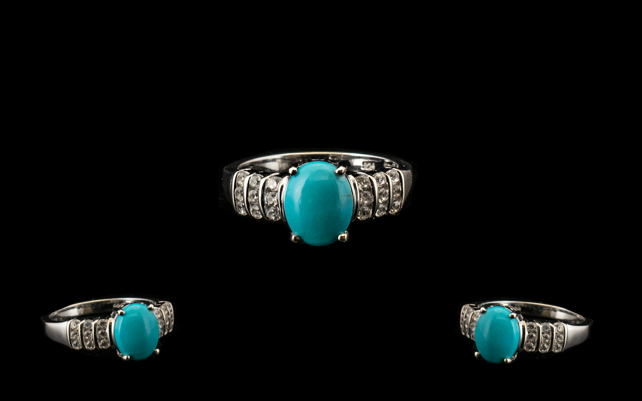 Sleeping Beauty Turquoise and White Zircon Ring, an oval cut cabochon of over 2cts of the bright,