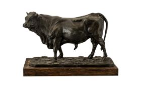 Spelter Figure of a Prize Bull after the antique model by P.J.Mene, on a wooden base.