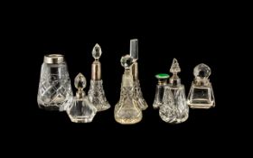 A Collection of Eight Cut Glass Mostly Scent Bottles some with silver collars A/F.