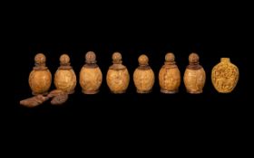 Eight Chinese Carved Walnut Shell Snuff Bottles,