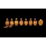 Eight Chinese Carved Walnut Shell Snuff Bottles,