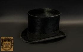 Black Top Hat with label 'D Craik, 100 Leith St,