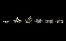 A Collection of Six Silver Dress Rings all set with coloured stones, various sizes.